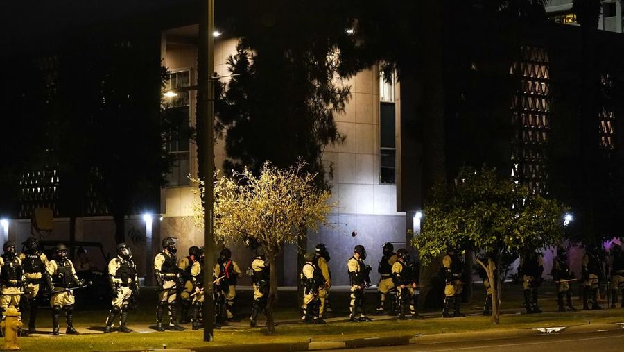 A large number of police surround the Arizona Capitol after protesters reached the front of the AZ Senate building following the Supreme Court's decision to overturn Roe v. Wade Friday, June 24, 2022, in Phoenix. (AP Photo/Ross D. Franklin)