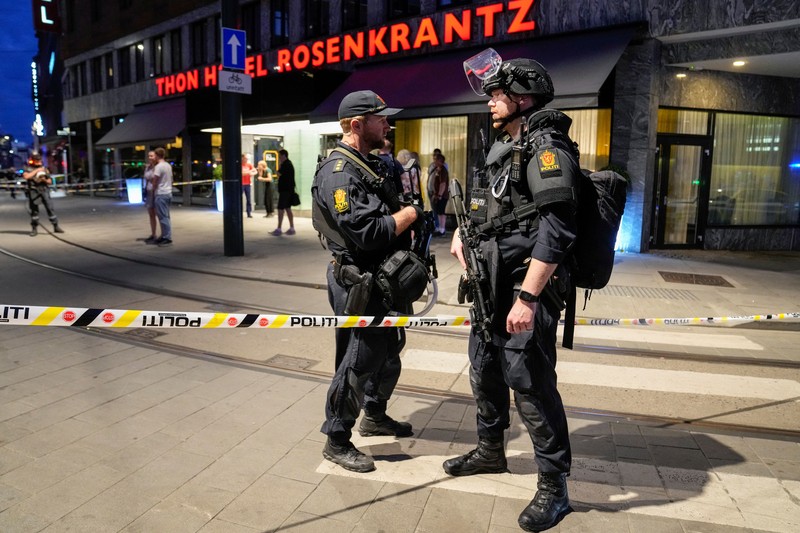 Norway Shooting Police gather at the site of a mass shooting in Oslo, early Saturday, June 25, 2022. Norwegian police say a few people have been killed and more than a dozen injured in a mass shooting. (Javad Parsa/NTB via AP)