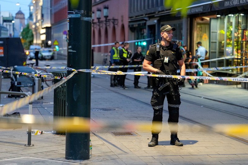 Norway Shooting Police gather at the site of a mass shooting in Oslo, early Saturday, June 25, 2022. Norwegian police say a few people have been killed and more than a dozen injured in a mass shooting. (Javad Parsa/NTB via AP)