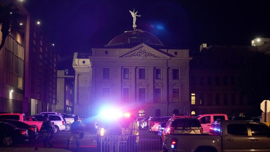 A large number of police surround the Arizona Capitol after protesters reached the front of the AZ Senate building following the Supreme Court's decision to overturn Roe v. Wade Friday, June 24, 2022, in Phoenix. (AP Photo/Ross D. Franklin)