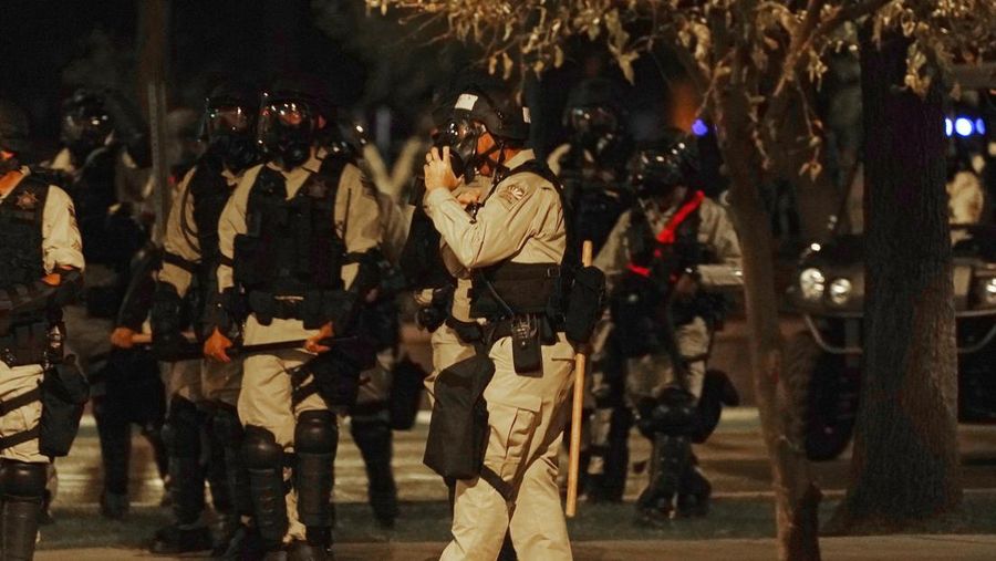A large number of police surround the Arizona Capitol after protesters reached the front of the AZ Senate building following the Supreme Court's decision to overturn Roe v. Wade Friday, June 24, 2022, in Phoenix. (AP Photo/Ross D. Franklin)
