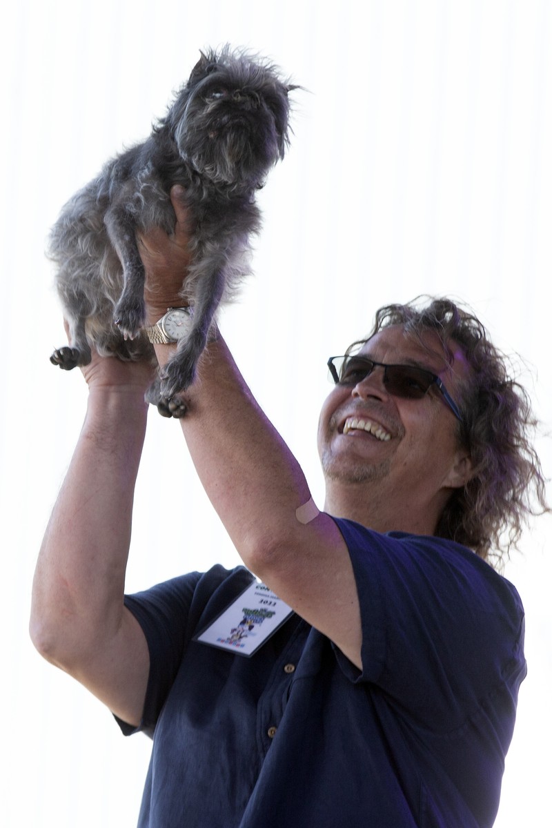 Contestants and their handlers line the stage at the World's Ugliest Dog competition, Friday, June 24, 2022, in Petaluma, Calif. (AP Photo/D. Ross Cameron)