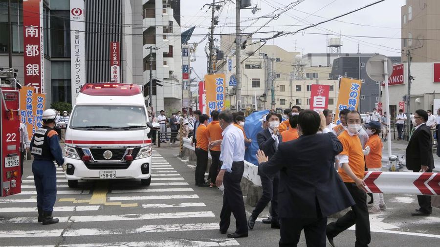 Former Japanese prime minister Shinzo Abe lies on the ground after apparent shooting during an election campaign for the July 10, 2022 Upper House election, in Nara, western Japan July 8, 2022. in this photo taken by Kyodo. Mandatory credit Kyodo via REUTERS ATTENTION EDITORS - THIS IMAGE WAS PROVIDED BY A THIRD PARTY. MANDATORY CREDIT. JAPAN OUT. NO COMMERCIAL OR EDITORIAL SALES IN JAPAN.