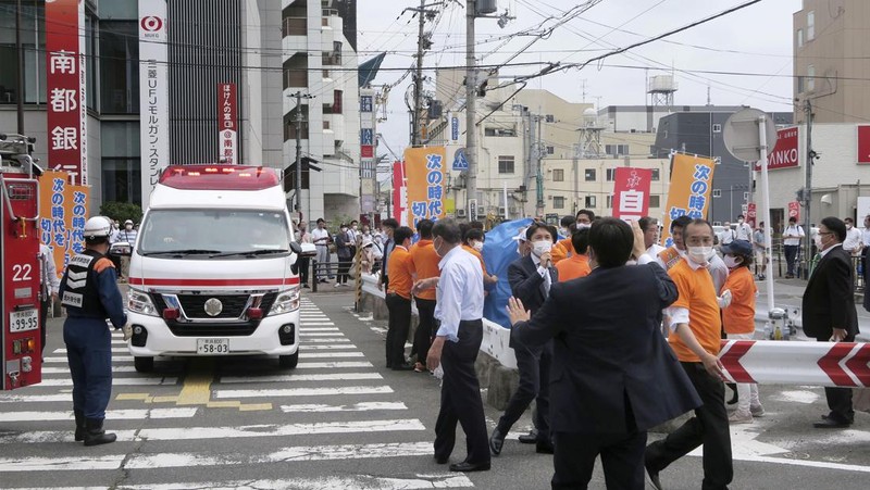 Former Japanese prime minister Shinzo Abe lies on the ground after apparent shooting during an election campaign for the July 10, 2022 Upper House election, in Nara, western Japan July 8, 2022. in this photo taken by Kyodo. Mandatory credit Kyodo via REUTERS ATTENTION EDITORS - THIS IMAGE WAS PROVIDED BY A THIRD PARTY. MANDATORY CREDIT. JAPAN OUT. NO COMMERCIAL OR EDITORIAL SALES IN JAPAN.