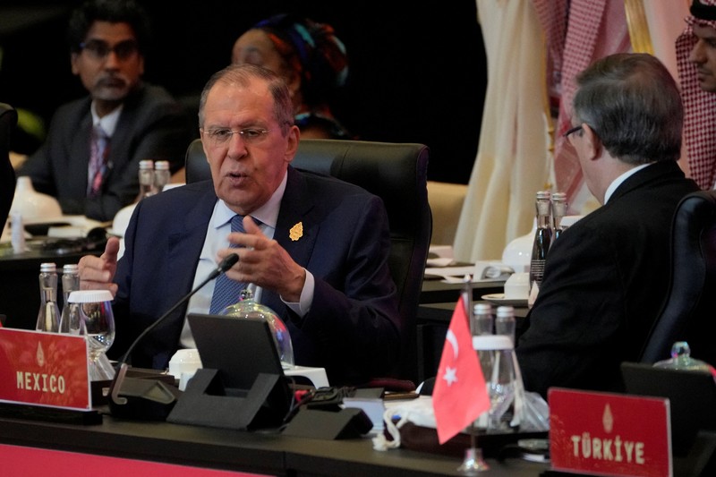 Russian Foreign Minister Sergey Lavrov gestures as he confers with Mexican Foreign Affairs Secretary Marcelo Ebrard prior to the start of the opening session of the G20 Foreign Ministers' Meeting in Nusa Dua, Bali, Indonesia July 8, 2022. Dita Alangkara/Pool via Reuters
