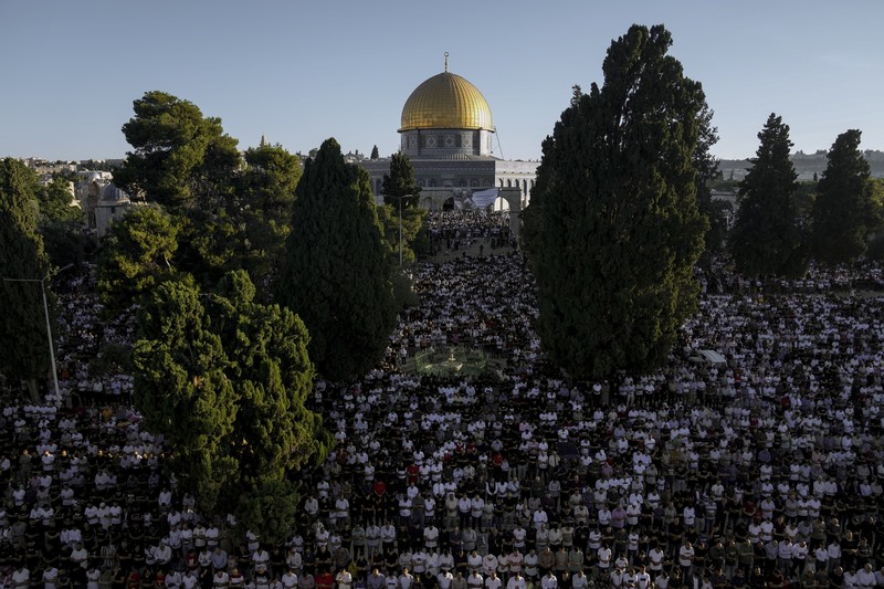 Saudi Arabia Hajj Muslim pilgrims walk to cast stones at a pillar in the symbolic stoning of the devil, during the last rite of the annual hajj, and the first day of Eid al-Adha, in Mina near the city of Mecca, Saudi Arabia, Saturday, July 9, 2022. (AP Photo/Amr Nabil)