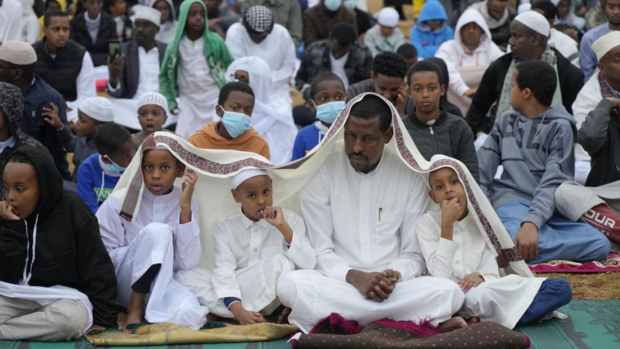 Muslim pilgrims walk to cast stones at a pillar in the symbolic stoning of the devil, during the last rite of the annual hajj, and the first day of Eid al-Adha, in Mina near the city of Mecca, Saudi Arabia, Saturday, July 9, 2022. (AP Photo/Amr Nabil)