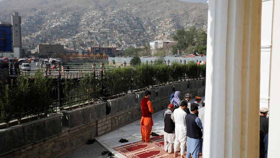 Afghan people pray on the first day of Eid al-Adha, in Kabul, Afghanistan, July 9, 2022. REUTERS/Ali Khara