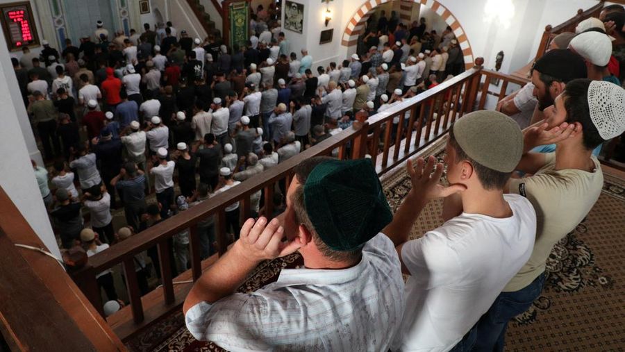 Muslim pilgrims walk to cast stones at a pillar in the symbolic stoning of the devil, during the last rite of the annual hajj, and the first day of Eid al-Adha, in Mina near the city of Mecca, Saudi Arabia, Saturday, July 9, 2022. (AP Photo/Amr Nabil)