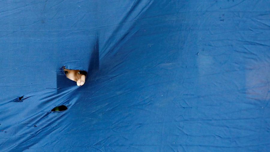 A cow is pictured before being sacrificed for the Muslim holiday of Eid Al-Adha outside a mosque in Jakarta, Indonesia, July 10, 2022. REUTERS/Ajeng Dinar Ulfiana