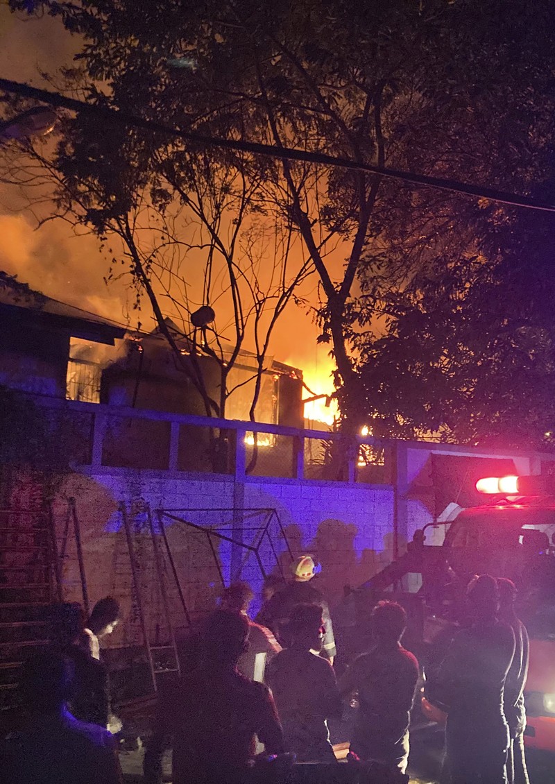A fire burns at Prime Minister Ranil Wickremesinghe's house, after it was set on fire by protestors, amid the country's economic crisis, in Colombo, Sri Lanka, July 9, 2022 in this screen grab obtained from social media video. Pradas S Agnya/via REUTERS  THIS IMAGE HAS BEEN SUPPLIED BY A THIRD PARTY. MANDATORY CREDIT.