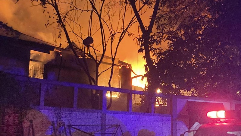 A fire burns at Prime Minister Ranil Wickremesinghe's house, after it was set on fire by protestors, amid the country's economic crisis, in Colombo, Sri Lanka, July 9, 2022 in this screen grab obtained from social media video. Pradas S Agnya/via REUTERS  THIS IMAGE HAS BEEN SUPPLIED BY A THIRD PARTY. MANDATORY CREDIT.