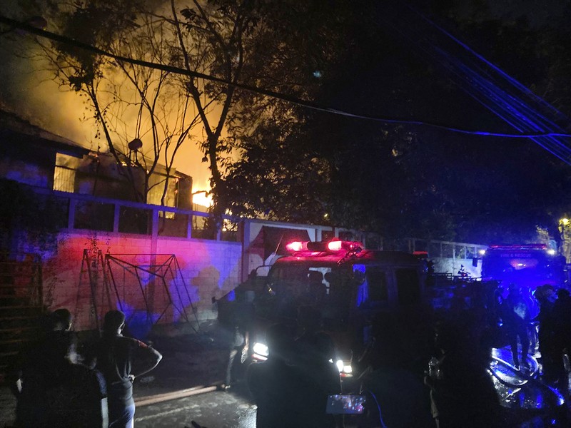 A fire burns at Prime Minister Ranil Wickremesinghe's house, after it was set on fire by protestors, amid the country's economic crisis, in Colombo, Sri Lanka, July 9, 2022 in this screen grab obtained from social media video. Pradas S Agnya/via REUTERS  THIS IMAGE HAS BEEN SUPPLIED BY A THIRD PARTY. MANDATORY CREDIT.