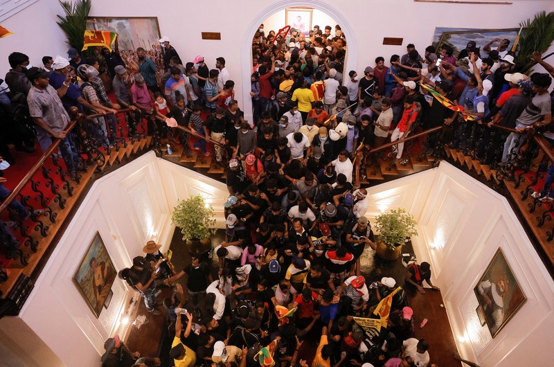 Demonstrators protest inside the President's House premises, after President Gotabaya Rajapaksa fled, amid the country's economic crisis, in Colombo, Sri Lanka, July 9, 2022. REUTERS/Dinuka Liyanawatte