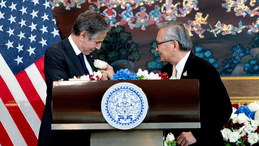 Thailand's Foreign Minister Don Pramudwinai places a flower on the jacket of U.S. Secretary of State Antony Blinken following remarks to the press after a Memorandum of Understanding signing ceremony at the Thai Ministry of Foreign Affairs in Bangkok, Thailand,  July 10, 2022. Stefani Reynolds/Pool via REUTERS
