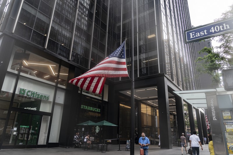 1241791087 NEW YORK, UNITED STATES - 2022/07/08: American flags were lowered in front of the building at 695 3rd Avenue, Manhattan where the Japanese Mission to the UN was located after the assassination of former Prime Minister of Japan Shinzo Abe. Mr. Abe was assassinated in the city of Nara during his speech at a campaign rally. (Photo by Lev Radin/Pacific Press/LightRocket via Getty Images)