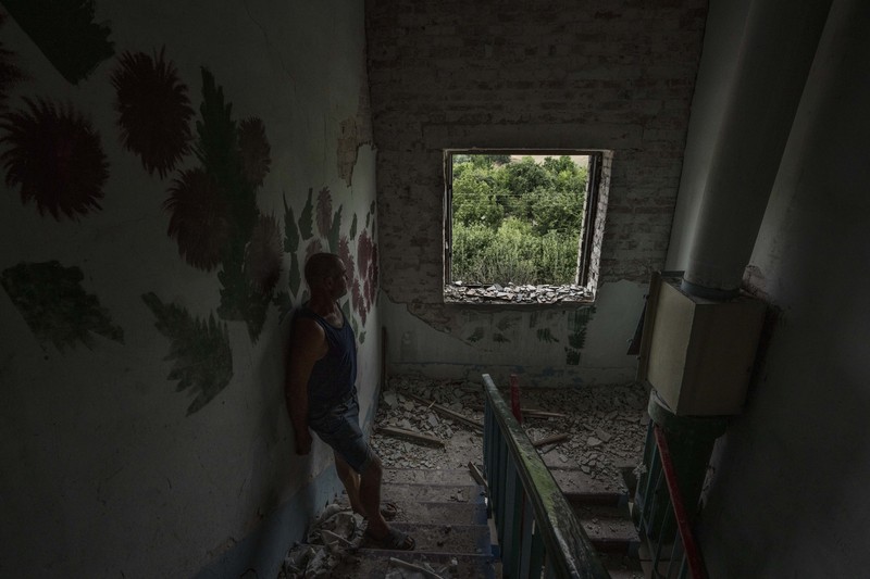 Russia Ukraine War A sofa chair is seen in what is left standing in the aftermath of a Russian rocket that hit an apartment residential block, in Chasiv Yar, Donetsk region, eastern Ukraine, Sunday, July 10, 2022. At least 15 people were killed and more than 20 people may still be trapped in the rubble, officials said Sunday. (AP Photo/Nariman El-Mofty)