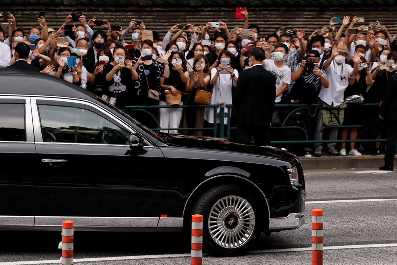 JAPAN-ABE/FUNERAL Akie Abe, wife of late former Japanese Prime Minister Shinzo Abe, who was shot while campaigning for a parliamentary election, sits in a vehicle carrying Abe's body, as she leaves after his funeral at Zojoji Temple in Tokyo, Japan July 12, 2022. REUTERS/Issei Kato