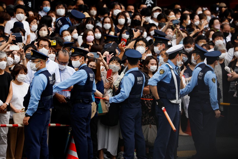 JAPAN-ABE/FUNERAL Akie Abe, wife of late former Japanese Prime Minister Shinzo Abe, who was shot while campaigning for a parliamentary election, sits in a vehicle carrying Abe's body, as she leaves after his funeral at Zojoji Temple in Tokyo, Japan July 12, 2022. REUTERS/Issei Kato