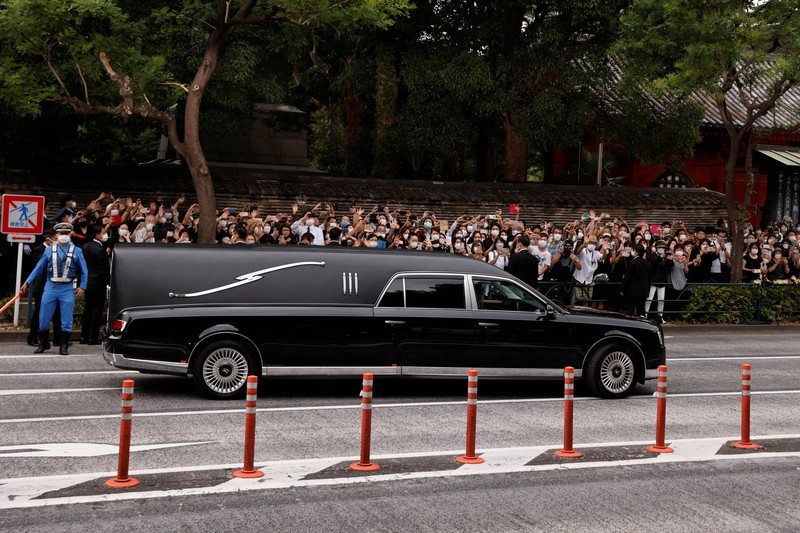 JAPAN-ABE/FUNERAL Akie Abe, wife of late former Japanese Prime Minister Shinzo Abe, who was shot while campaigning for a parliamentary election, sits in a vehicle carrying Abe's body, as she leaves after his funeral at Zojoji Temple in Tokyo, Japan July 12, 2022. REUTERS/Issei Kato