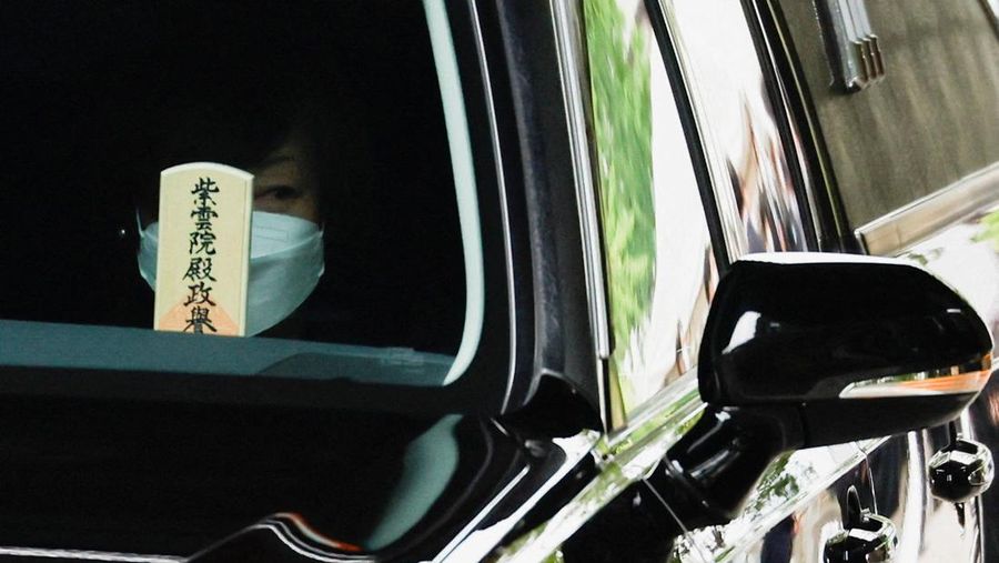 Akie Abe, wife of late former Japanese Prime Minister Shinzo Abe, who was shot while campaigning for a parliamentary election, sits in a vehicle carrying Abe's body, as she leaves after his funeral at Zojoji Temple in Tokyo, Japan July 12, 2022. REUTERS/Issei Kato