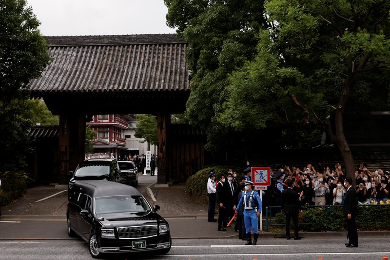 JAPAN-ABE/FUNERAL Akie Abe, wife of late former Japanese Prime Minister Shinzo Abe, who was shot while campaigning for a parliamentary election, sits in a vehicle carrying Abe's body, as she leaves after his funeral at Zojoji Temple in Tokyo, Japan July 12, 2022. REUTERS/Issei Kato
