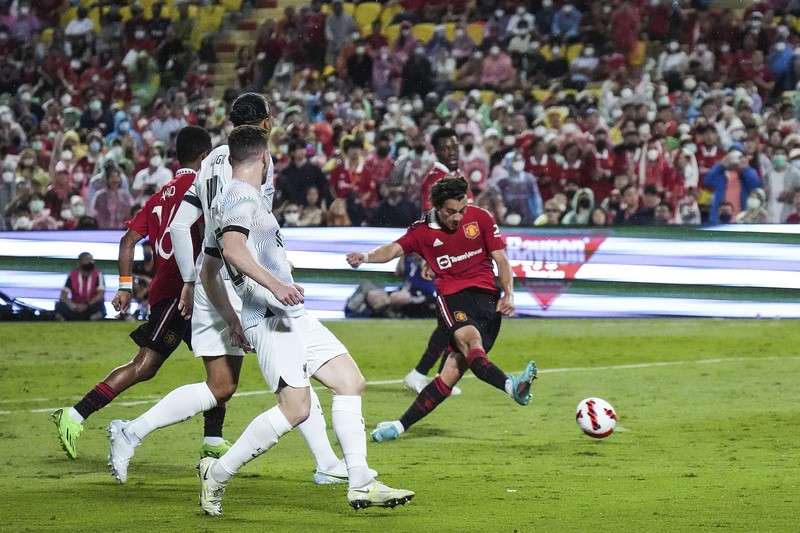 Thailand Manchester United Liverpool Soccer Manchester United Jadon Sancho, left, shoot to score during their pre-season kicks Rajamangala national stadium In Bangkok, Thailand, Tuesday, July 12, 2022. Manchester United beat Liverpool 4-0. (AP Photo/Wason Wanichakorn)