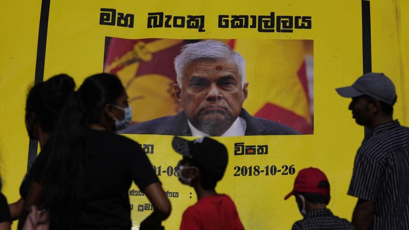 Sri Lanka police men patrol at the official residence of president Gotabaya Rajapaksa fourth days after it was stormed by anti government protesters in Colombo in Colombo, Sri Lanka, Wednesday, July 13, 2022. The president of Sri Lanka fled the country early Wednesday, July 13, days after protesters stormed his home and office and the official residence of his prime minister amid a monthslong economic crisis that triggered severe shortages of food and fuel.(AP Photo/Rafiq Maqbool)
