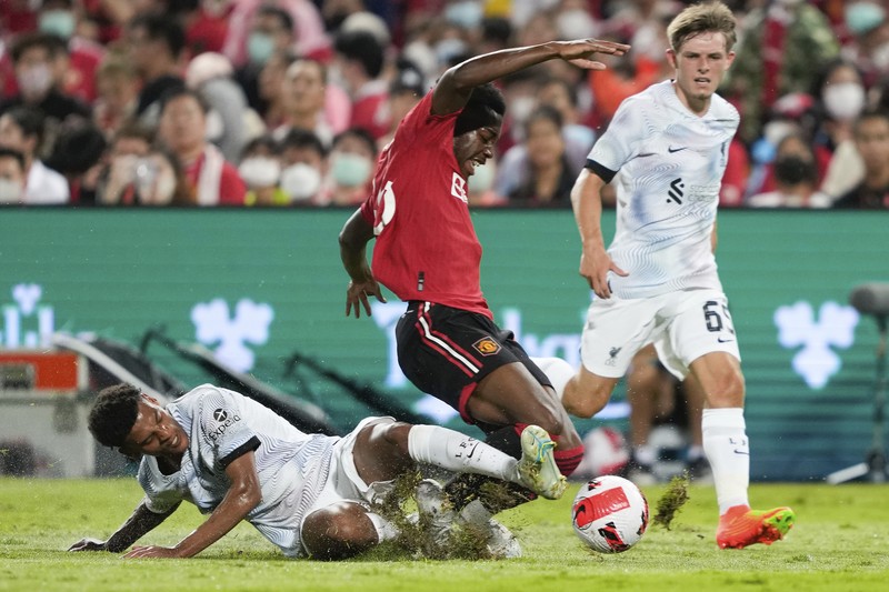 Thailand Manchester United Liverpool Soccer Manchester United Jadon Sancho, left, shoot to score during their pre-season kicks Rajamangala national stadium In Bangkok, Thailand, Tuesday, July 12, 2022. Manchester United beat Liverpool 4-0. (AP Photo/Wason Wanichakorn)
