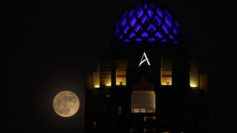 ISTANBUL, TURKIYE  - JULY 13: Super moon rises over Grand Camlica Mosque in Istanbul, Turkiye on July 13, 2022. (Photo by Ali Atmaca/Anadolu Agency via Getty Images)