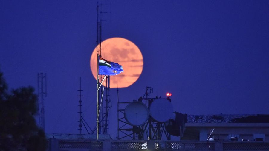 ISTANBUL, TURKIYE  - JULY 13: Super moon rises over Grand Camlica Mosque in Istanbul, Turkiye on July 13, 2022. (Photo by Ali Atmaca/Anadolu Agency via Getty Images)