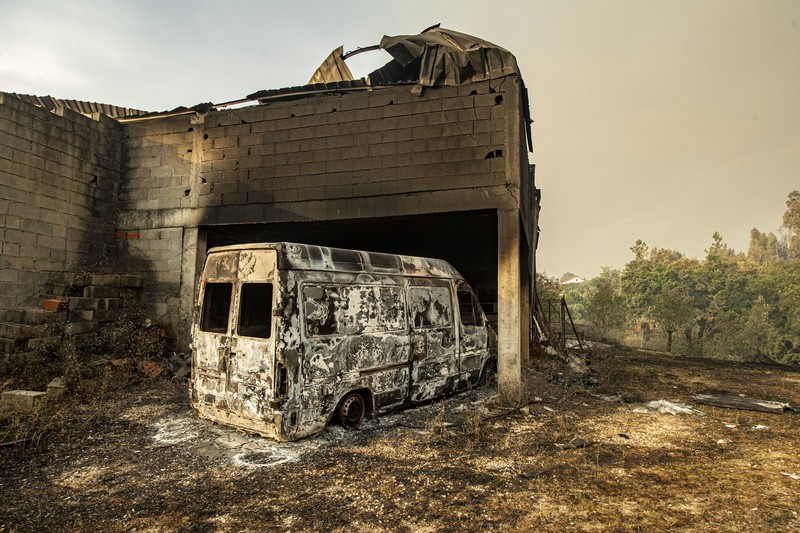 POMBAL, PORTUGAL - JULY 14: This photograph shows a burnt car on a carpentry company at Ansiao on July 14, 2022 in Pombal, Portugal. Wildfires have swept across the central part of the country amid temperatures exceeding 40 degrees celsius. (Photo by Octavio Passos/Getty Images)