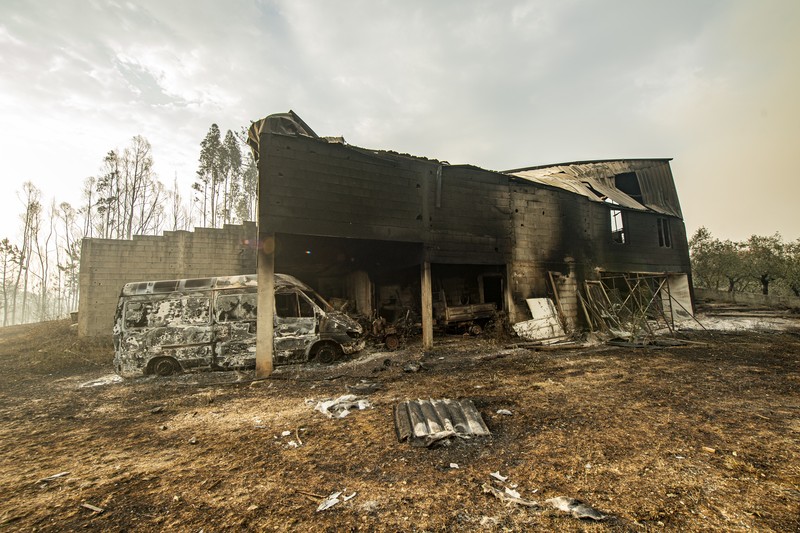 POMBAL, PORTUGAL - JULY 14: This photograph shows a burnt car on a carpentry company at Ansiao on July 14, 2022 in Pombal, Portugal. Wildfires have swept across the central part of the country amid temperatures exceeding 40 degrees celsius. (Photo by Octavio Passos/Getty Images)
