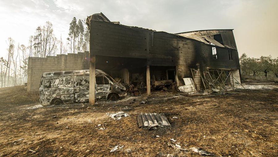POMBAL, PORTUGAL - JULY 14: This photograph shows a burnt car on a carpentry company at Ansiao on July 14, 2022 in Pombal, Portugal. Wildfires have swept across the central part of the country amid temperatures exceeding 40 degrees celsius. (Photo by Octavio Passos/Getty Images)