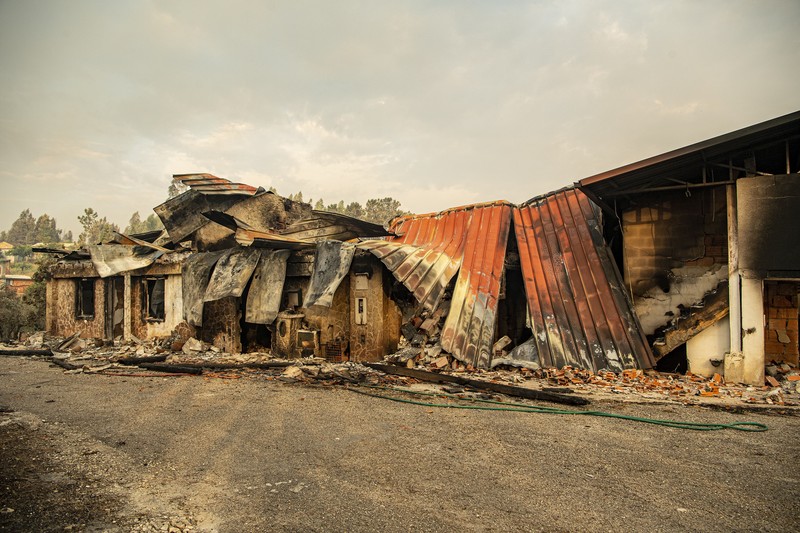POMBAL, PORTUGAL - JULY 14: This photograph shows a burnt car on a carpentry company at Ansiao on July 14, 2022 in Pombal, Portugal. Wildfires have swept across the central part of the country amid temperatures exceeding 40 degrees celsius. (Photo by Octavio Passos/Getty Images)