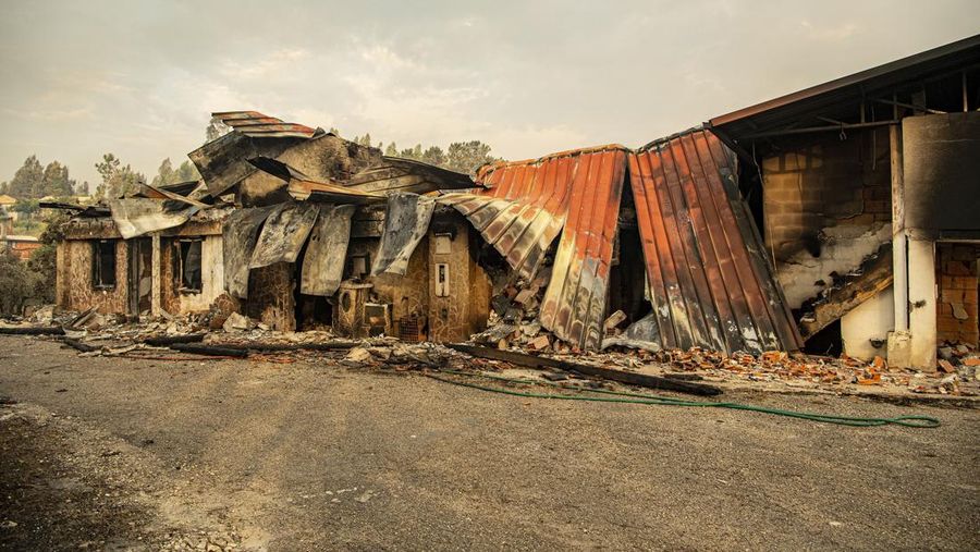 POMBAL, PORTUGAL - JULY 14: This photograph shows a burnt car on a carpentry company at Ansiao on July 14, 2022 in Pombal, Portugal. Wildfires have swept across the central part of the country amid temperatures exceeding 40 degrees celsius. (Photo by Octavio Passos/Getty Images)
