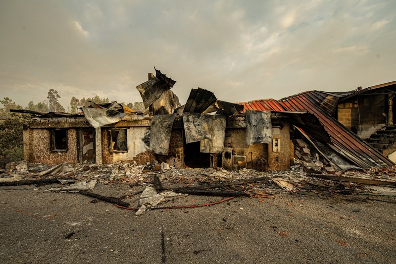 1241889297 POMBAL, PORTUGAL - JULY 14: This photograph shows a burnt car on a carpentry company at Ansiao on July 14, 2022 in Pombal, Portugal. Wildfires have swept across the central part of the country amid temperatures exceeding 40 degrees celsius. (Photo by Octavio Passos/Getty Images)