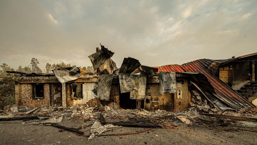 POMBAL, PORTUGAL - JULY 14: This photograph shows a burnt car on a carpentry company at Ansiao on July 14, 2022 in Pombal, Portugal. Wildfires have swept across the central part of the country amid temperatures exceeding 40 degrees celsius. (Photo by Octavio Passos/Getty Images)