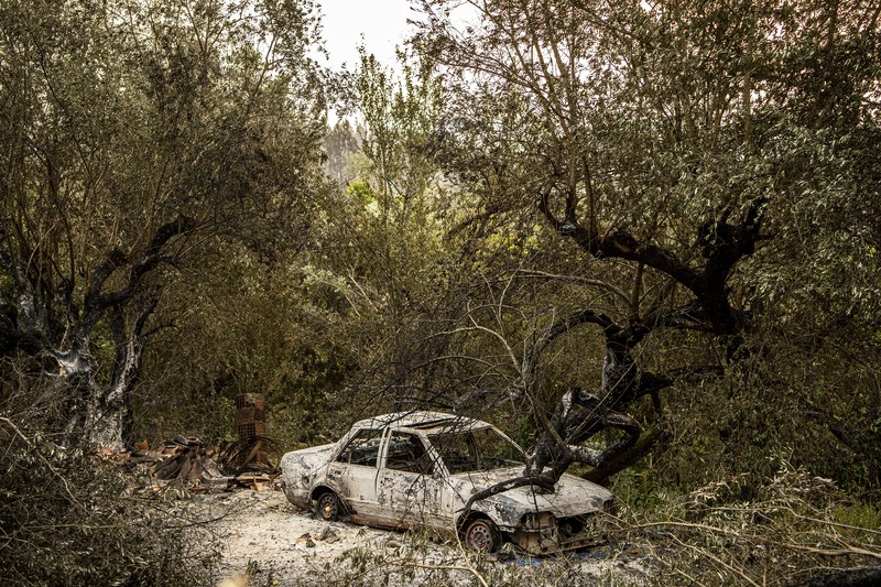 POMBAL, PORTUGAL - JULY 14: This photograph shows a burnt car on a carpentry company at Ansiao on July 14, 2022 in Pombal, Portugal. Wildfires have swept across the central part of the country amid temperatures exceeding 40 degrees celsius. (Photo by Octavio Passos/Getty Images)