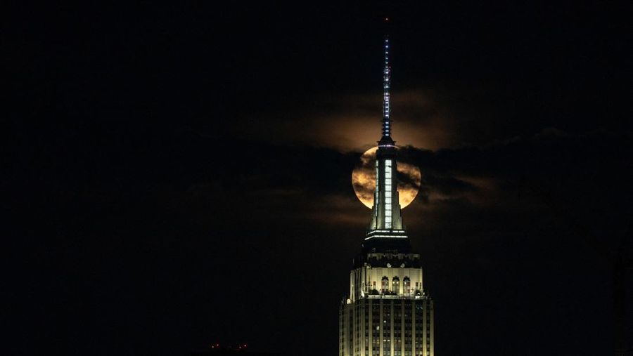 ISTANBUL, TURKIYE  - JULY 13: Super moon rises over Grand Camlica Mosque in Istanbul, Turkiye on July 13, 2022. (Photo by Ali Atmaca/Anadolu Agency via Getty Images)