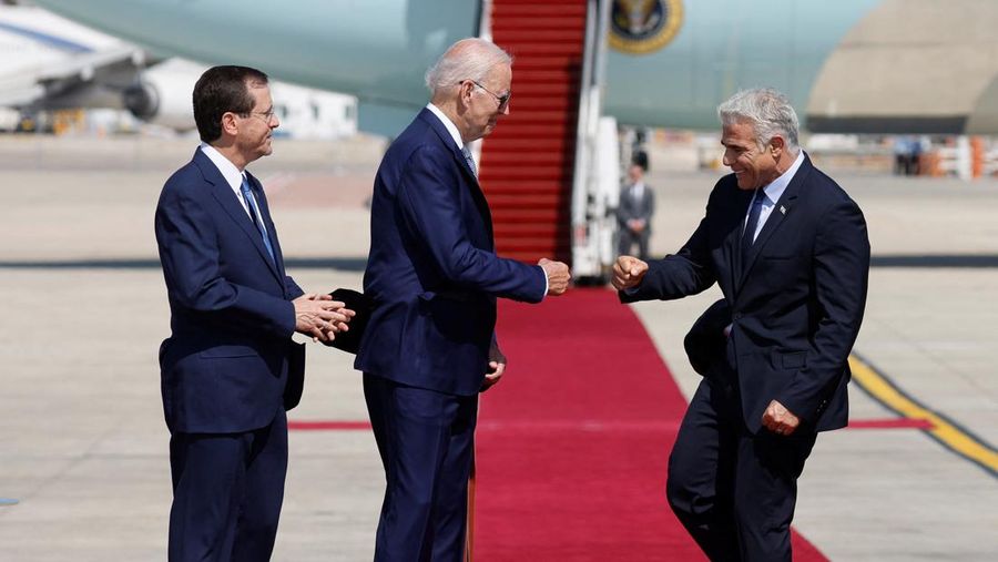 Israeli President Isaac Herzog, U.S. President Joe Biden and Israeli Prime Minister Yair Lapid participate in a welcoming ceremony at Ben Gurion International Airport in Lod, near Tel Aviv, Israel, July 13, 2022. REUTERS/Amir Cohen