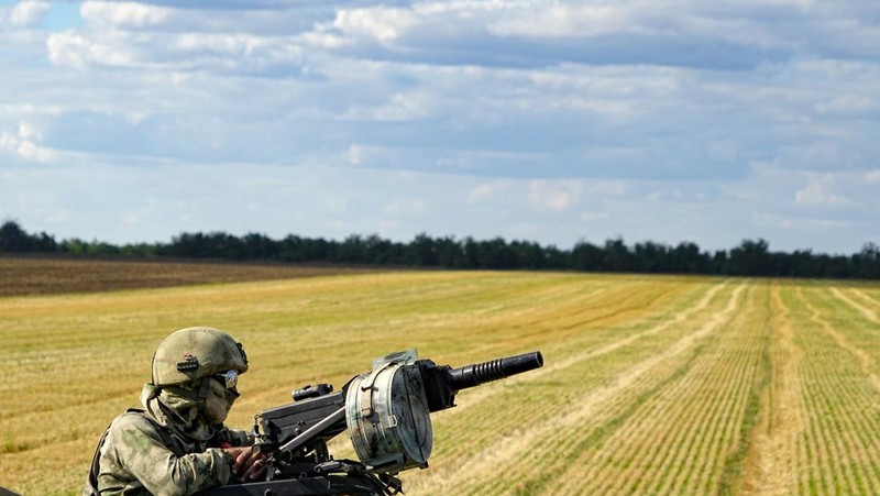 Farmers of the Voznesenka-Agro farm harvest with their combine in a wheat field not far from Melitopol, south Ukraine, Thursday, July 14, 2022. About 300,000 tonnes of harvest have been collected in Melitopol district of Zaporizhzhia region. Russia took control of part of the Zaporizhzhia region quickly after the launch of the military operation in Ukraine. This photo was taken during a trip organized by the Russian Ministry of Defense. (AP Photo)