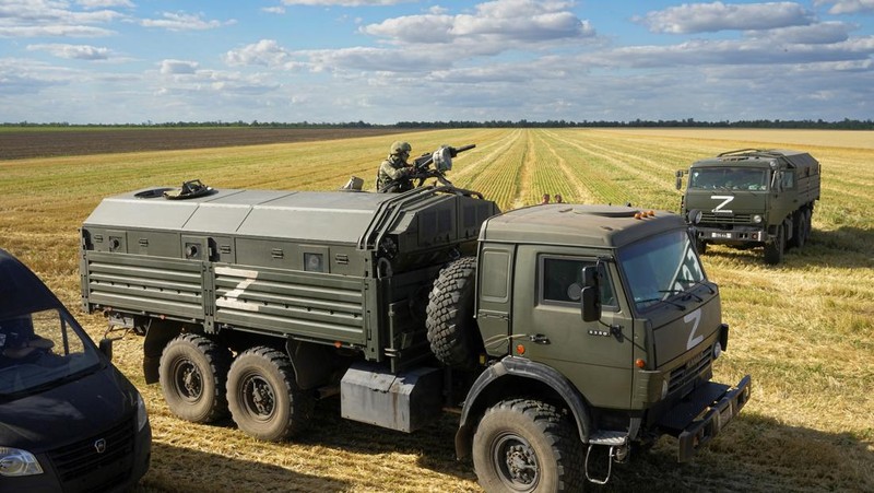 Farmers of the Voznesenka-Agro farm harvest with their combine in a wheat field not far from Melitopol, south Ukraine, Thursday, July 14, 2022. About 300,000 tonnes of harvest have been collected in Melitopol district of Zaporizhzhia region. Russia took control of part of the Zaporizhzhia region quickly after the launch of the military operation in Ukraine. This photo was taken during a trip organized by the Russian Ministry of Defense. (AP Photo)