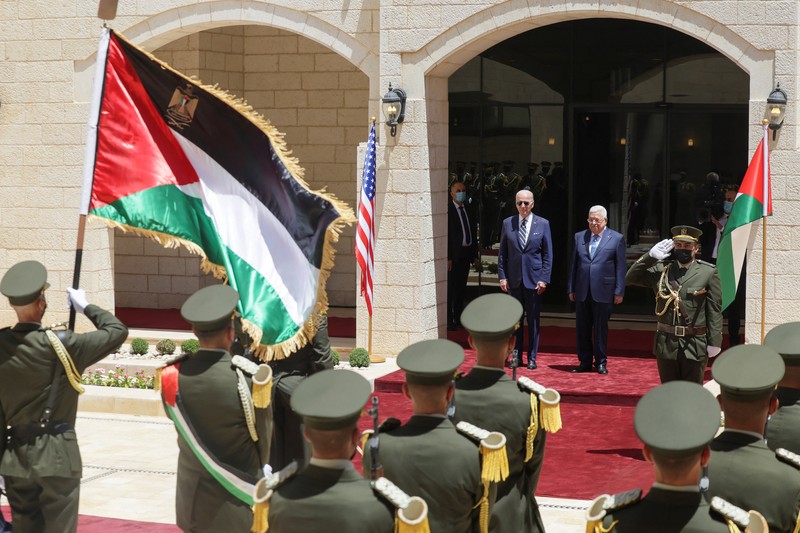 U.S. President Joe Biden shakes hands with Palestinian President Mahmoud Abbas at the Presidential Compound, in Bethlehem, in the Israeli-occupied West Bank July 15, 2022. REUTERS/Evelyn Hockstein