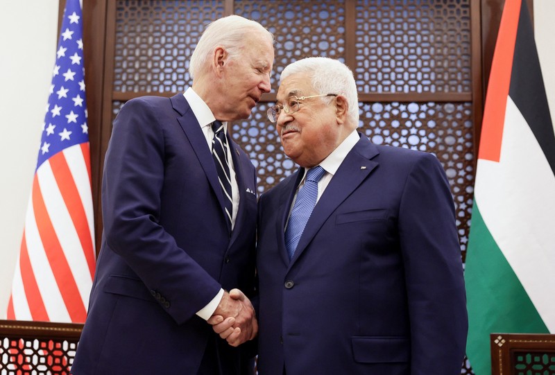U.S. President Joe Biden shakes hands with Palestinian President Mahmoud Abbas at the Presidential Compound, in Bethlehem, in the Israeli-occupied West Bank July 15, 2022. REUTERS/Evelyn Hockstein