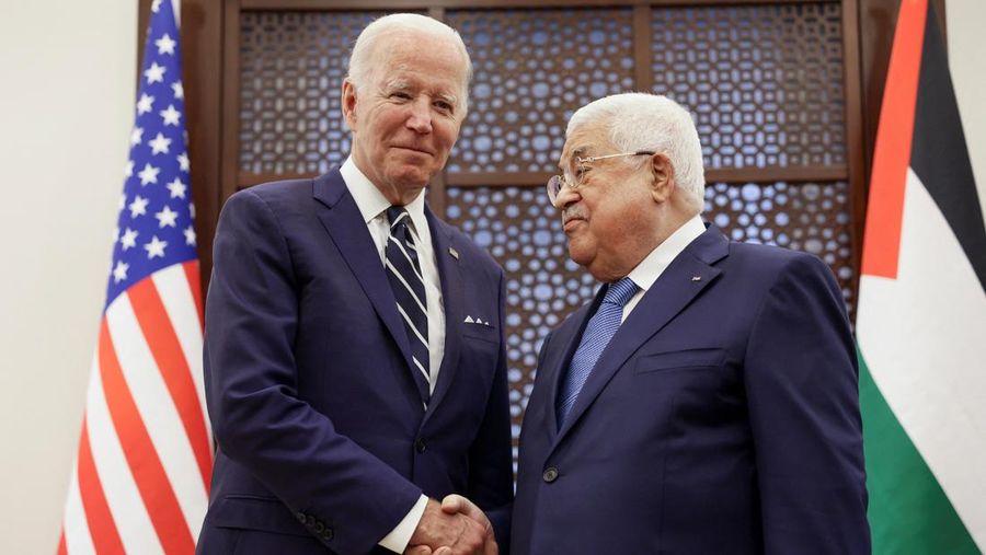 U.S. President Joe Biden shakes hands with Palestinian President Mahmoud Abbas at the Presidential Compound, in Bethlehem, in the Israeli-occupied West Bank July 15, 2022. REUTERS/Evelyn Hockstein