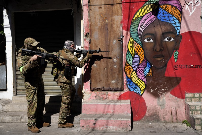 Polisi melakukan operasi di favela Complexo do Alemao di Rio de Janeiro, Brasil, Kamis, 21 Juli 2022. (AP/Silvia Izquierdo) Polisi melakukan operasi di favela Complexo do Alemao di Rio de Janeiro, Brasil, Kamis, 21 Juli 2022. (AP/Silvia Izquierdo)