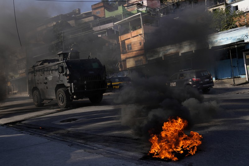 Polisi melakukan operasi di favela Complexo do Alemao di Rio de Janeiro, Brasil, Kamis, 21 Juli 2022. (AP/Silvia Izquierdo) Polisi melakukan operasi di favela Complexo do Alemao di Rio de Janeiro, Brasil, Kamis, 21 Juli 2022. (AP/Silvia Izquierdo)