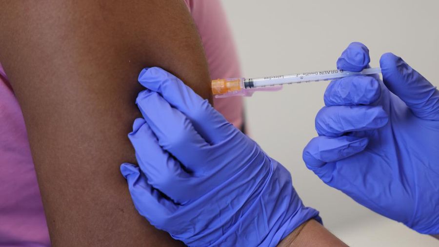 LONDON, ENGLAND - JULY 23: Doctor, Molly Dickinson administers a dose of the monkeypox vaccine to Arthur Macedo, 37 on July 23, 2022 in London, England. The NHS is expanding its  rollout in London as monkeypox cases continue to increase in the capital. Monkeypox, a rare disease, is part of the same family of viruses as smallpox. (Photo by Hollie Adams/Getty Images)