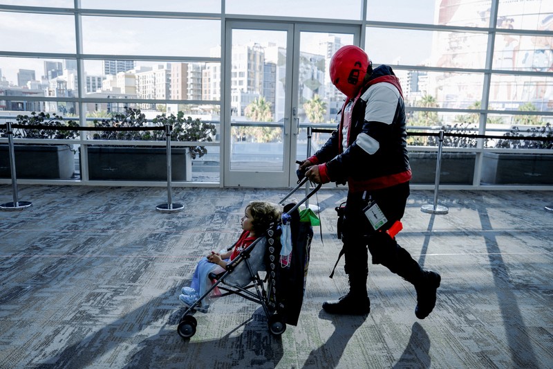 CALIFORNIA-COMICCON/ Performers cosplay as characters from the Netflix animated series Farzar to promote the show, outside Comic-Con International in San Diego, California, U.S., July 22, 2022. REUTERS/Bing Guan
